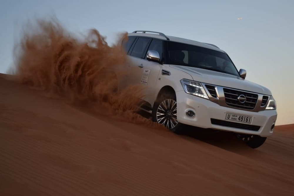 Dubai: Desert Safari Quad Bike Camel Ride and Sandboarding | ®ExcursionMania - Image 1