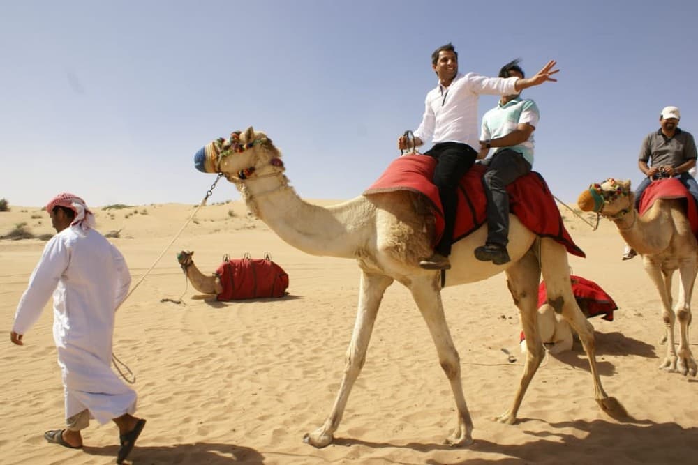 Dubai: Desert Safari Quad Bike Camel Ride and Sandboarding | ®ExcursionMania - Image 9