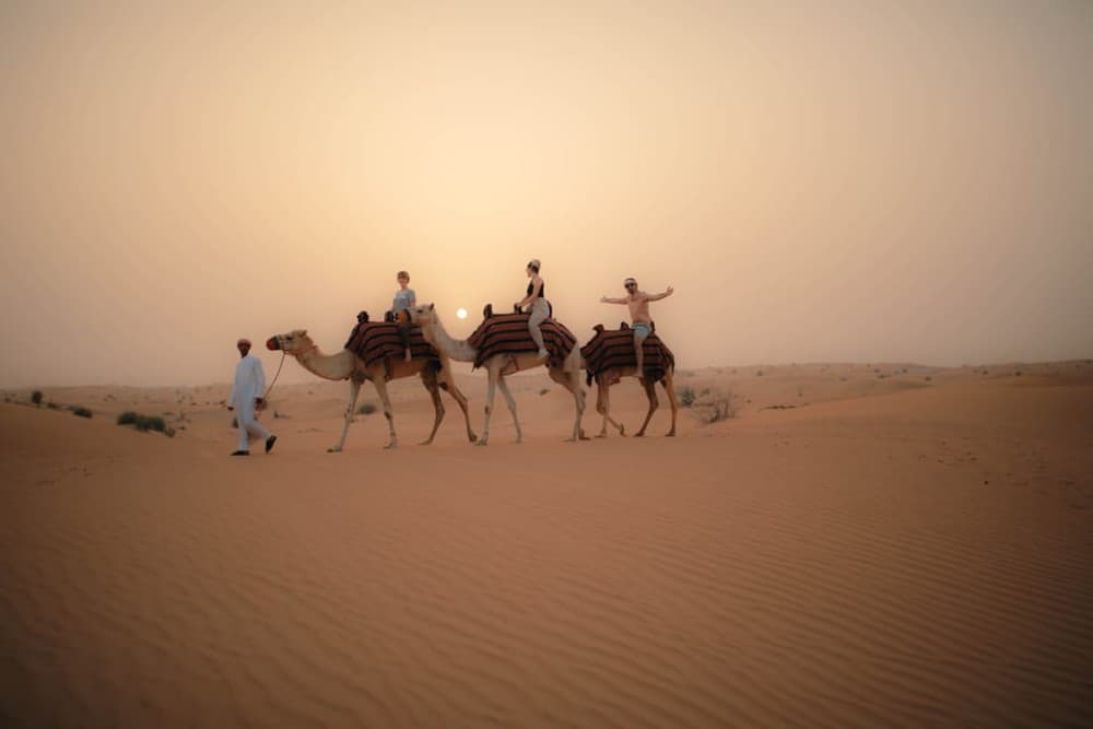 Dubai: Evening Camel Trekking & Dinner at Al Marmoom Oasis | ®ExcursionMania - Image 5