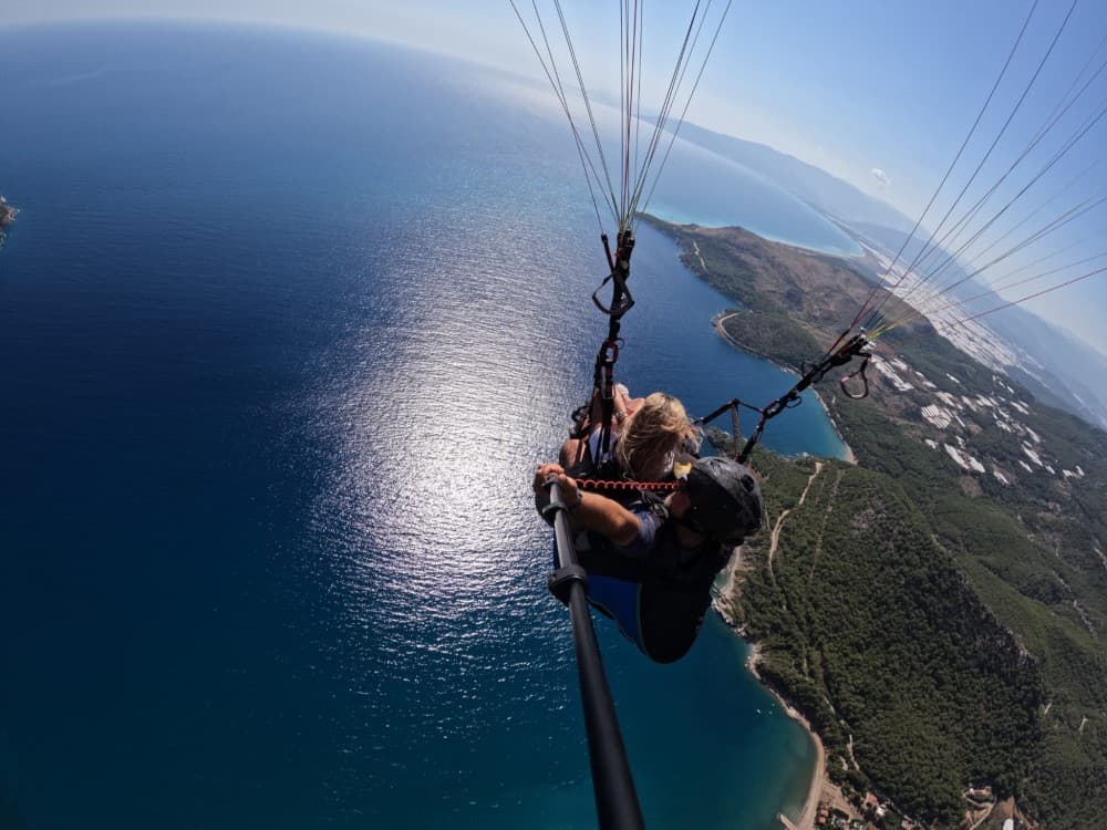 From Antalya: Paragliding Flight at Olympos Tahtali Mountain | ®ExcursionMania - Image 1