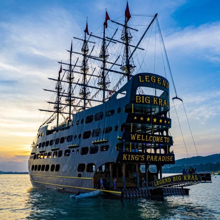 Side Sunset Boat Tour with Dinner, Drinks, and Entertainment | ®ExcursionMania - Image 1