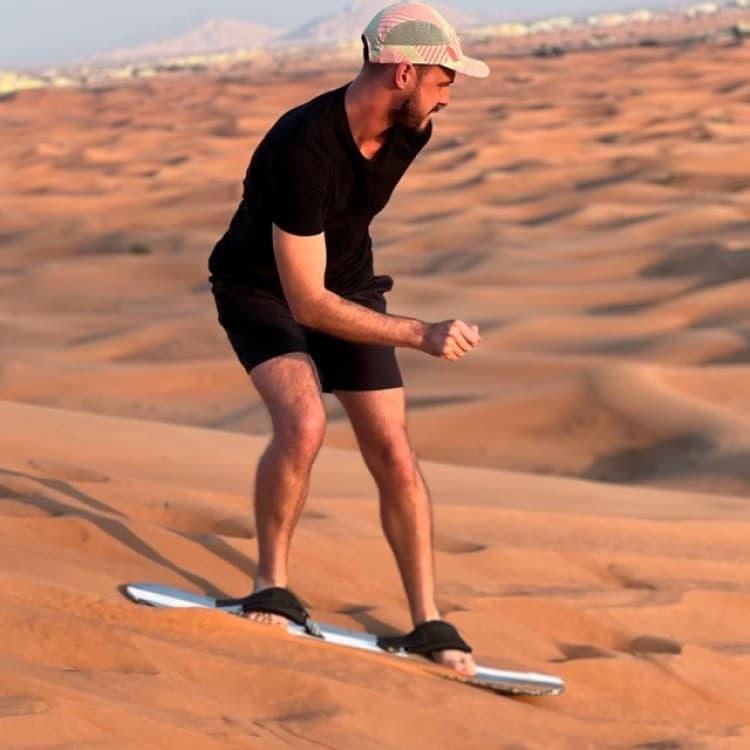 Dubai Desert Safari with BBQ Dinner, Camel Ride, Sandboard & Quad Bike | ®ExcursionMania - Image 4