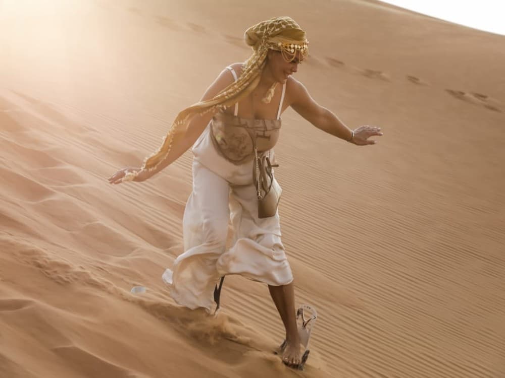 Abu Dhabi: Desert Safari with BBQ Camel Ride & Sandboarding