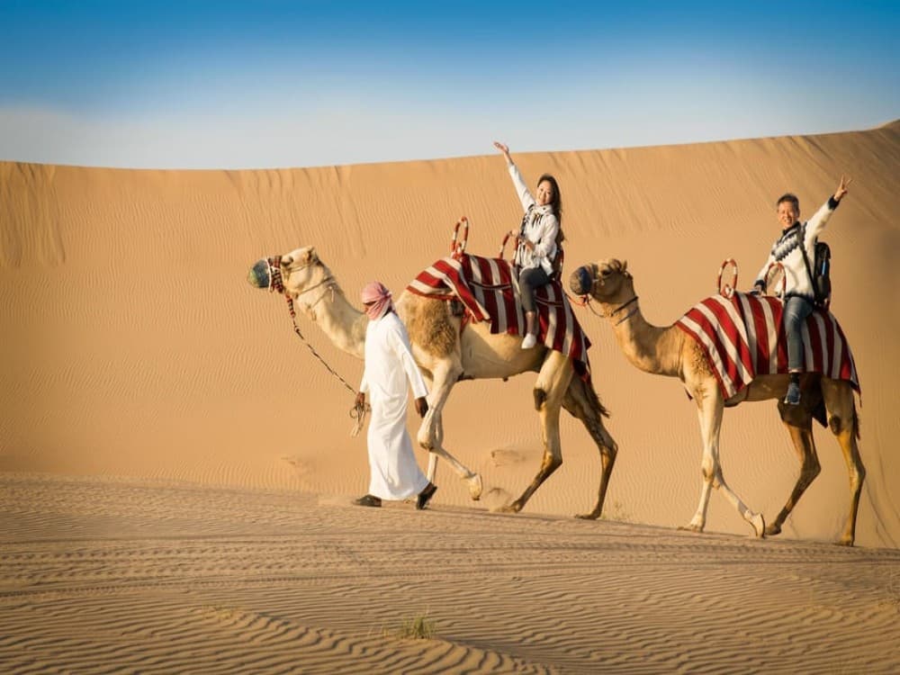 Doha: Safari Camel Ride Sandboarding and Inland Sea Tour | ®ExcursionMania - Image 1